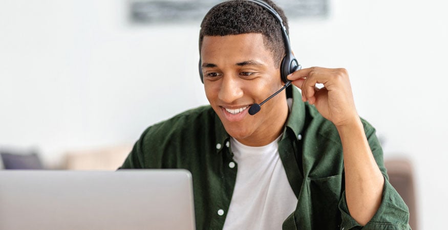 Employee with a headset working from home