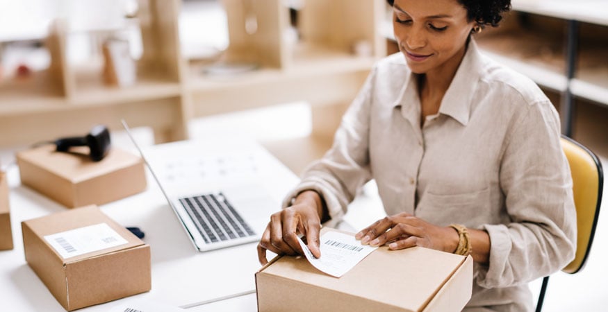 Placing a mailing label on a box