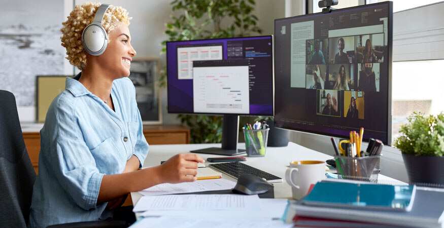 businesswoman working remotely on a video meeting with others