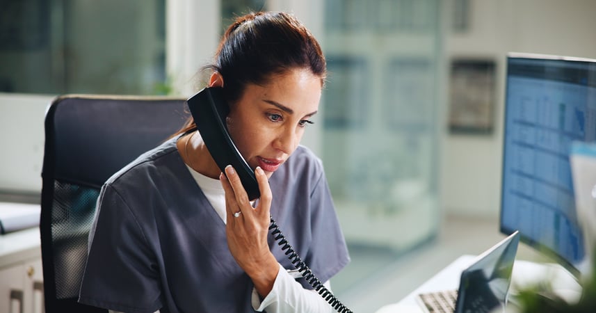 Nurse at medical clinic on a telephone call with a patient