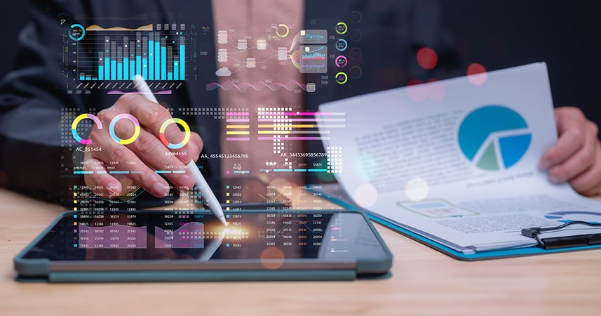 graphs and charts as an employee analyzes data
