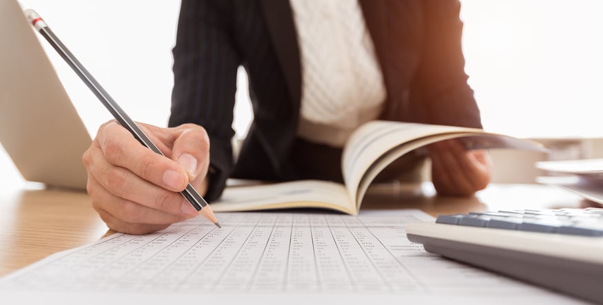 woman writing in notebook