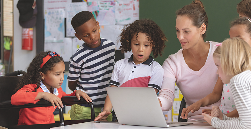 woman teaching kids on laptop