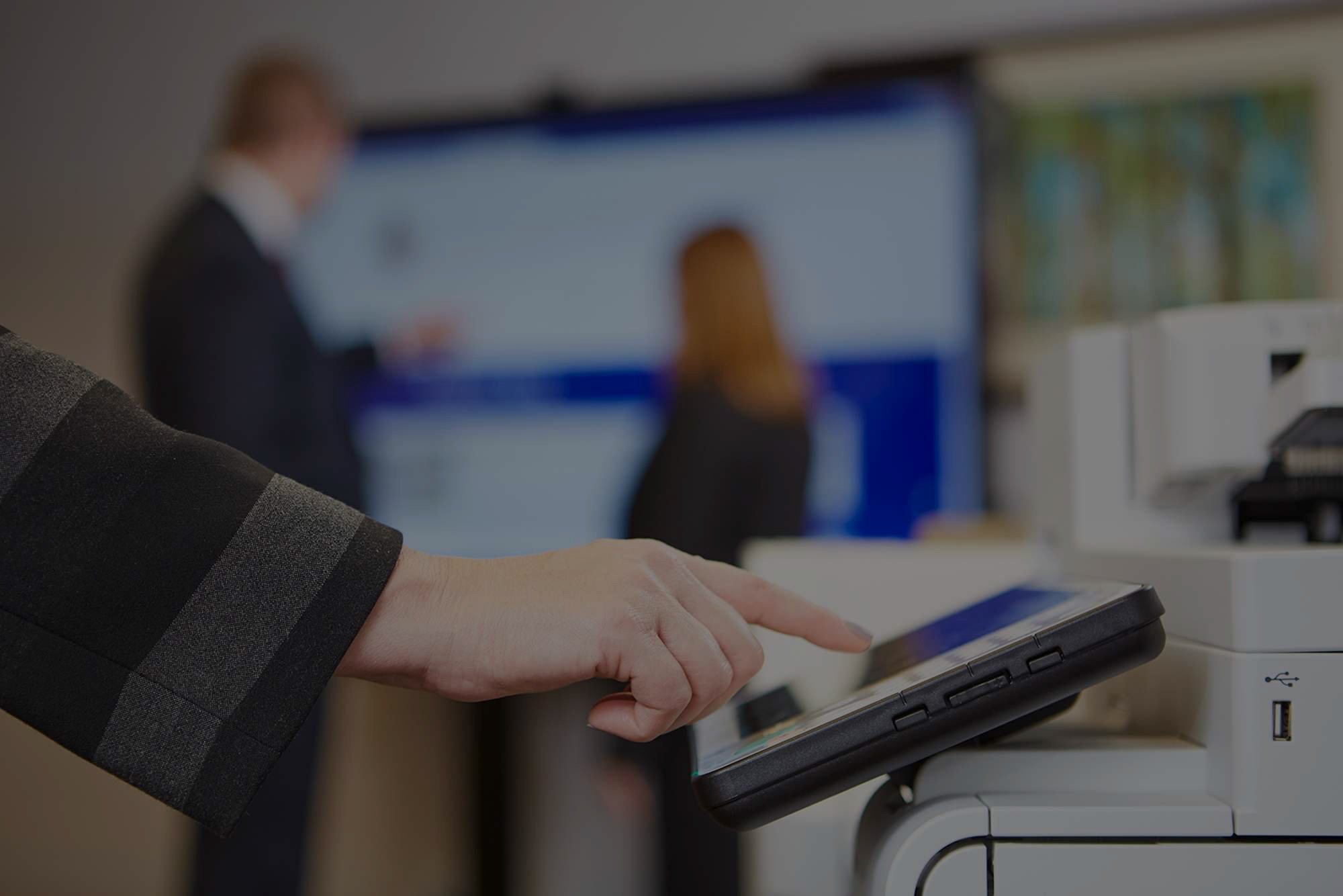 hand-interacting-with-touch-screen-on-printer-drk