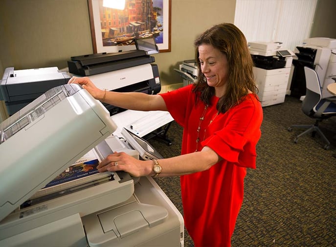 Person using a copier.