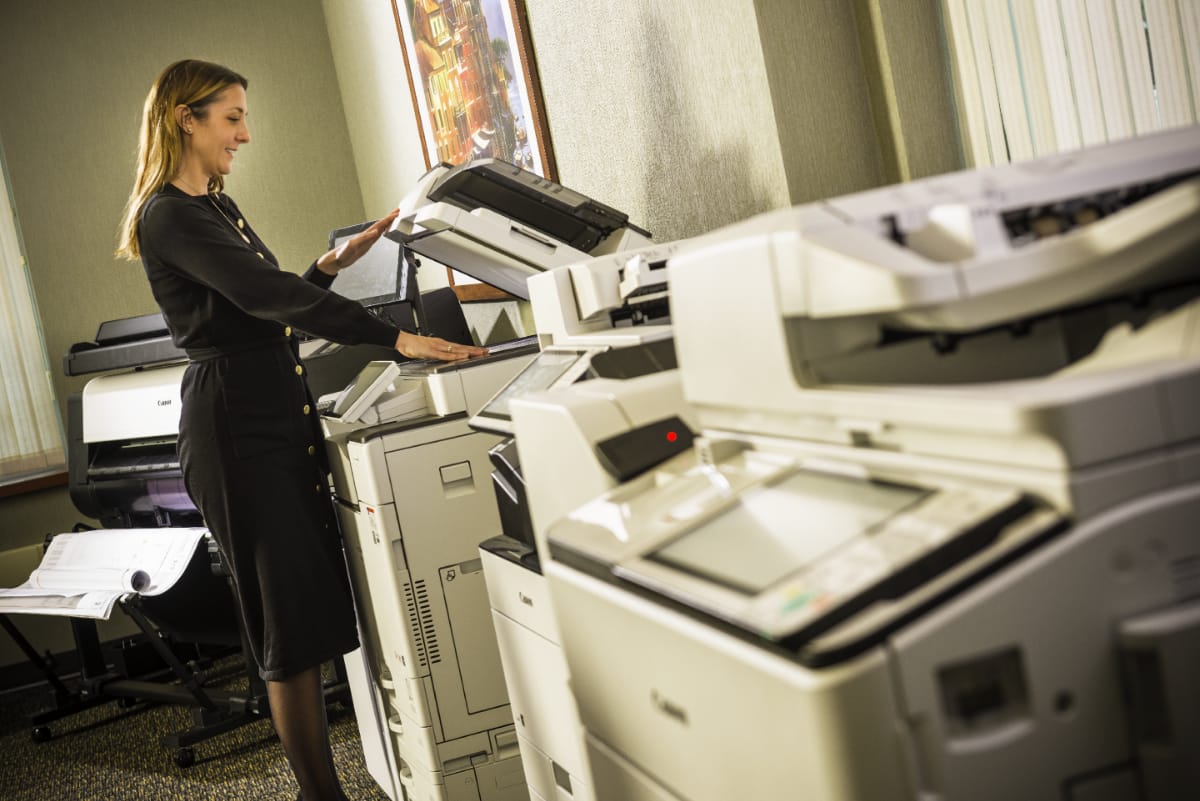 person-using-a-scanner-in-room-with-mulitple-scanners