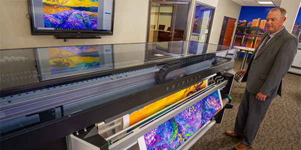 A large format printer printing a high resolution image.
