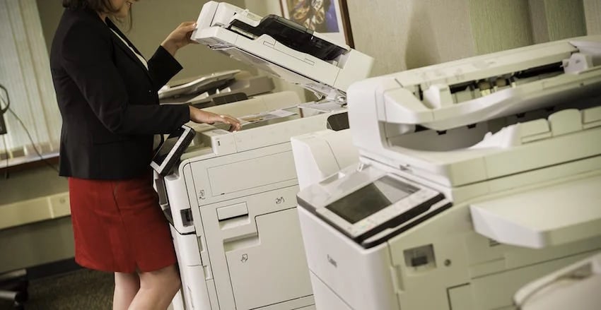 woman making a copy at a copier