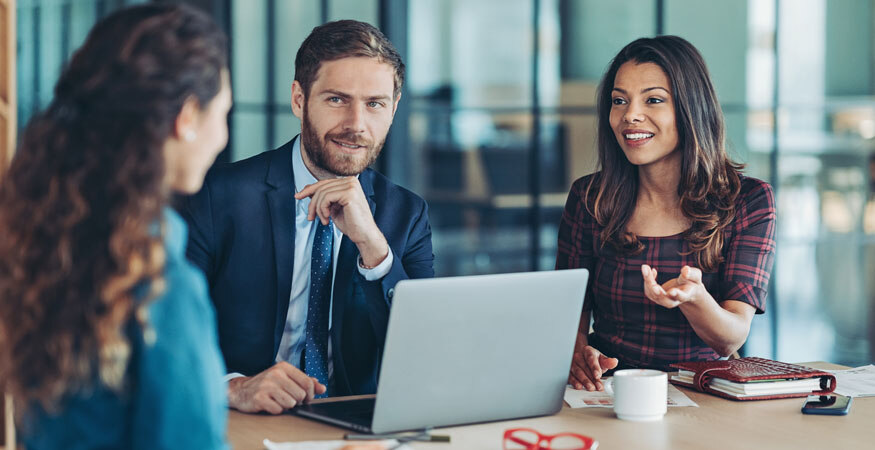 businesspeople discussing data in conference room