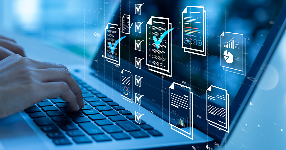hands on a keyboard of a laptop viewing multiple documents on screen