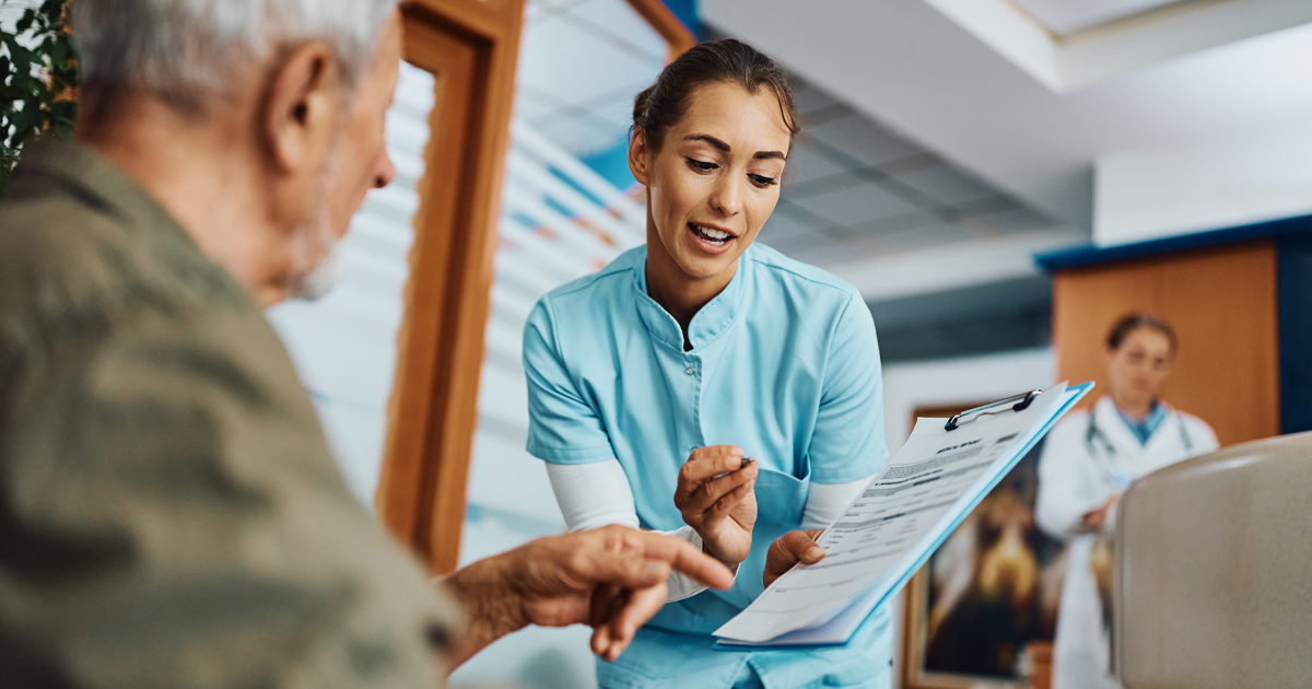 Medical provider reviewing printed after care instructions with patient