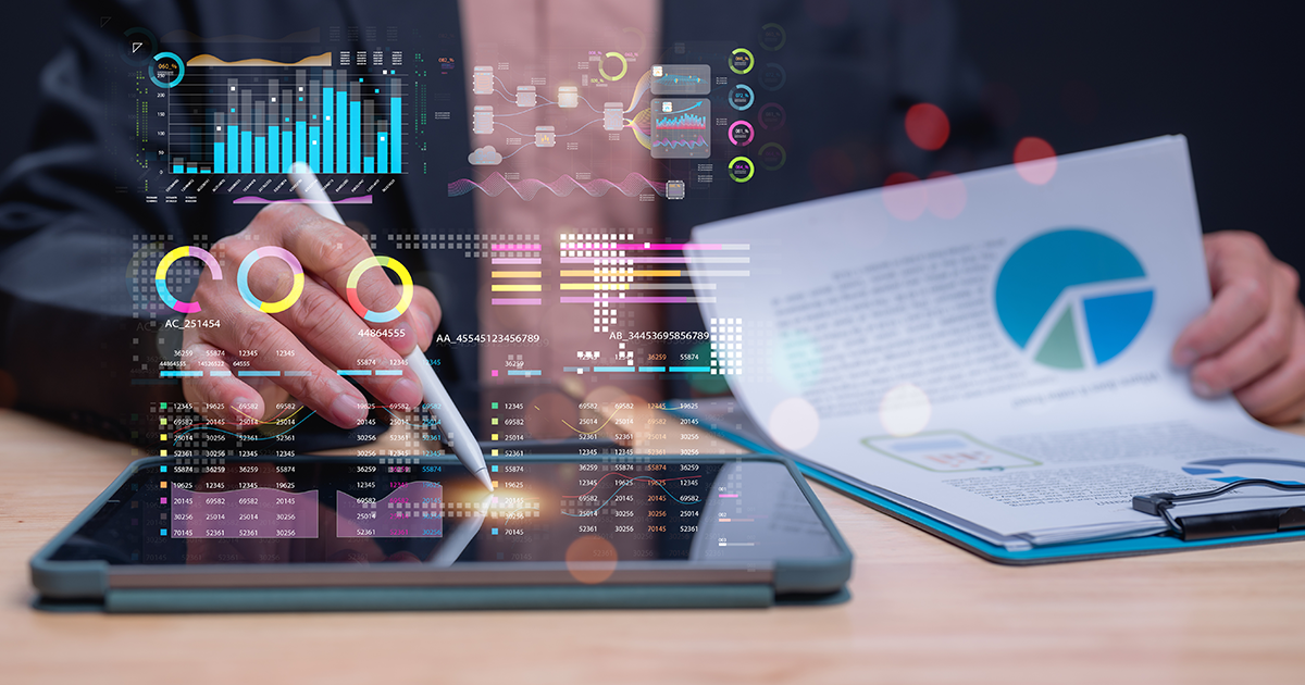 graphs and charts as an employee analyzes data