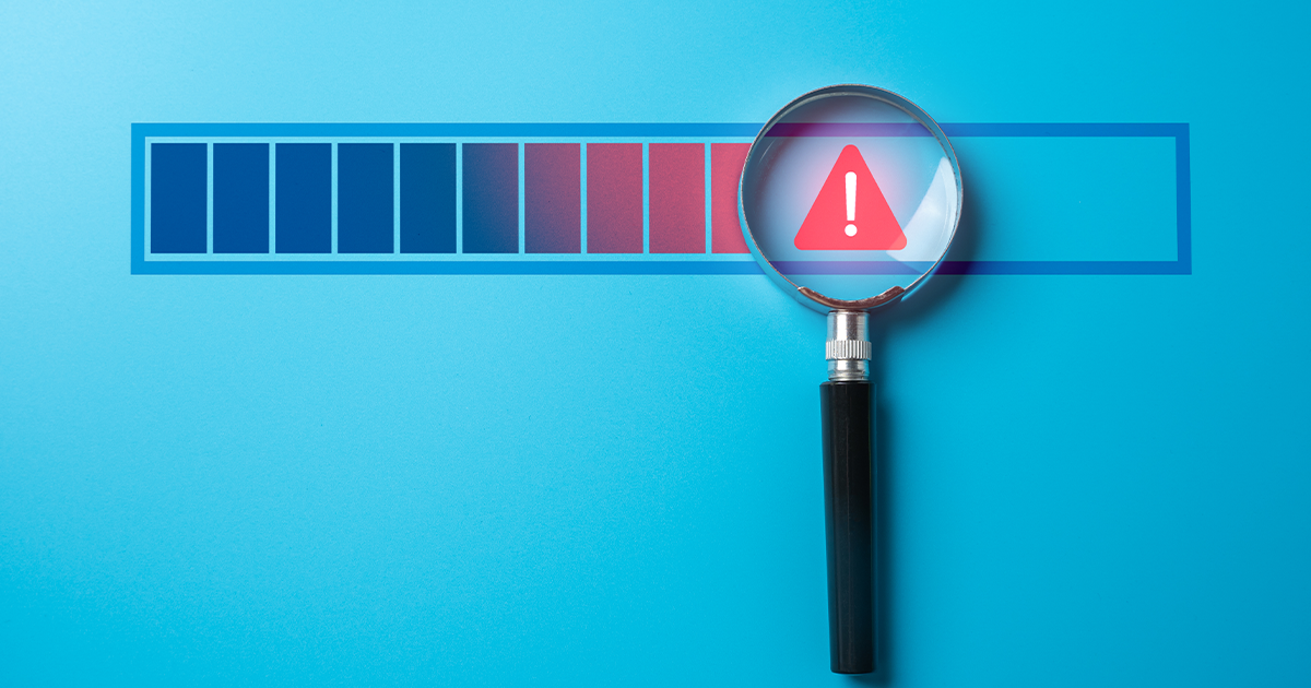 magnifying glass over a warning symbol next to colored bars in a row