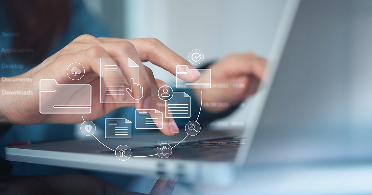 Office employee hands typing on a laptop